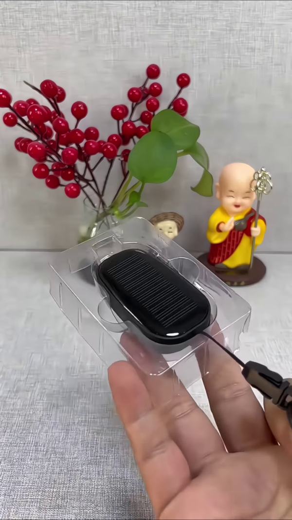 Compact Solar Powered Mobile Device Charger - Portable Energy Solution for Smartphones - Image 2