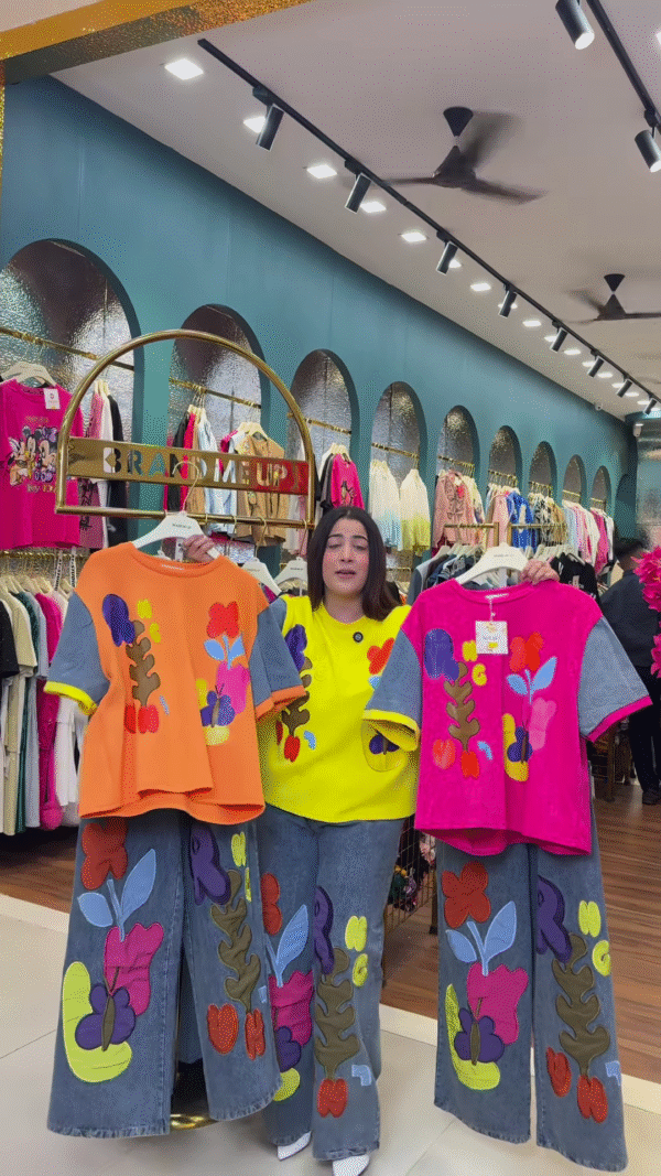 Multicolor Printed Ethnicwear Rack Display – Bold Floral & Abstract Garments in Boutique Interior with Teal-Gold Accents - Image 4