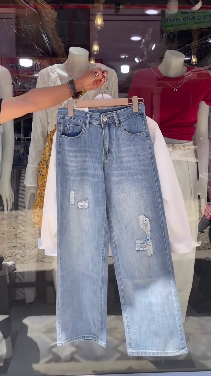 Embroidered White Shirt and Light-Wash Denim Ensemble - Image 2